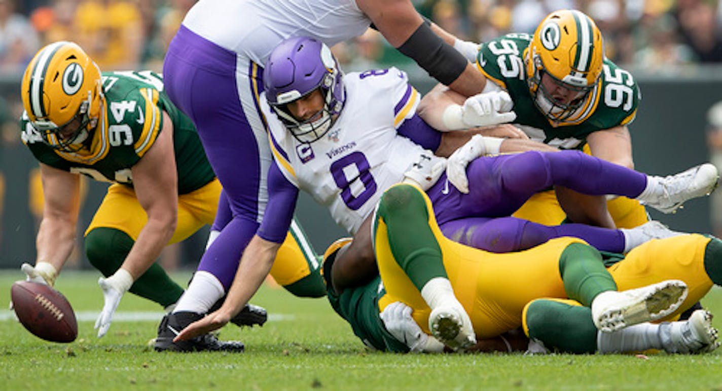 Minnesota Vikings  quarterback Kirk Cousins (8) fumbled the ball that was recovered by Green Bay Packers' Dean Lowry (94) in the first quarter on Sept. 15, 2019 at Lambeau Field in Green Bay, Wisconsin. (Carlos Gonzalez/Minneapolis Star Tribune/TNS) ORG XMIT: 1429878