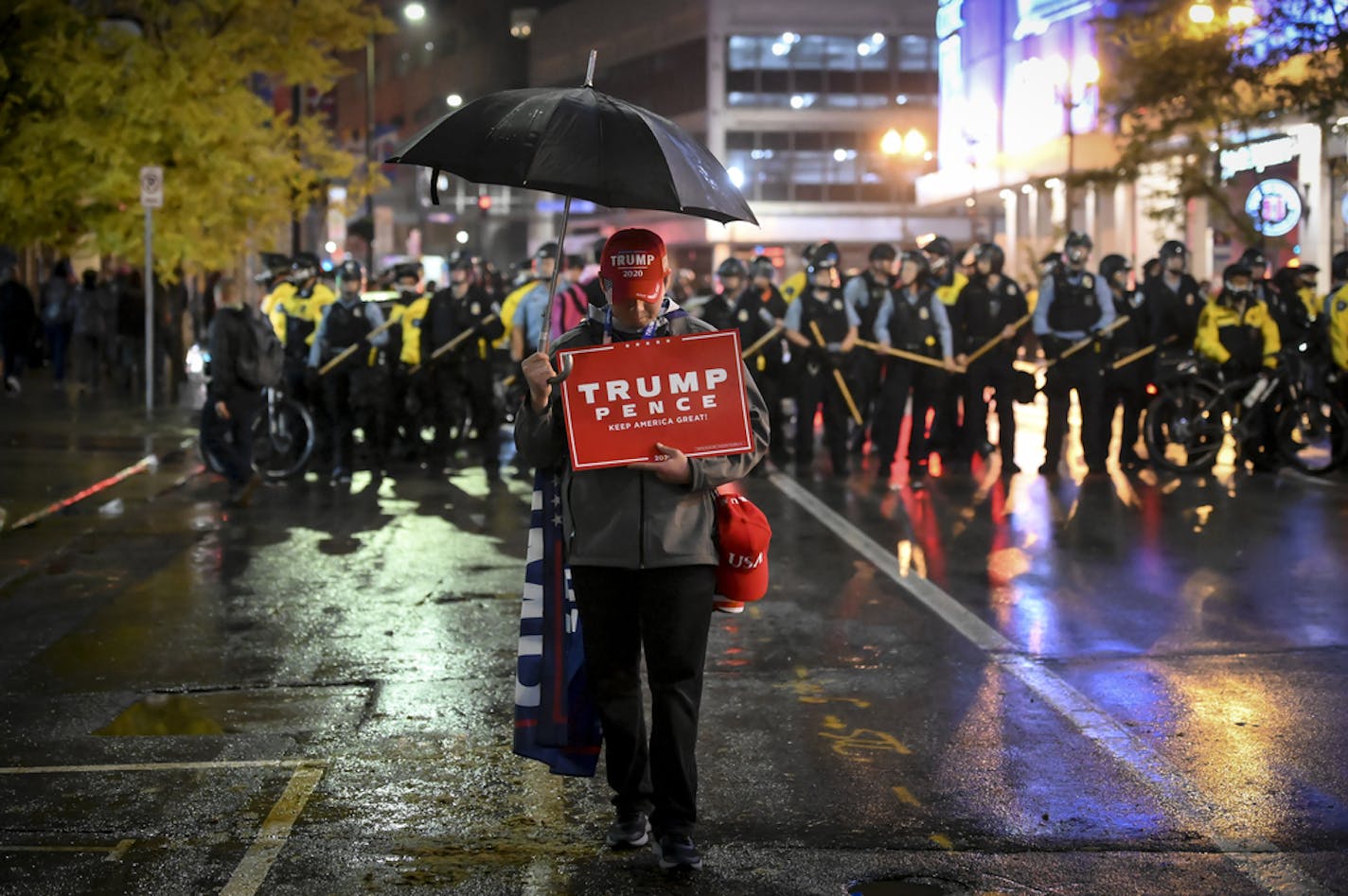 Chris Windego, of International Falls, showed his support for President Trump while demonstrating outside Target Center following Trump's campaign rally Thursday night. ] Aaron Lavinsky &#x2022; aaron.lavinsky@startribune.com President Donald Trump and Vice President Mike Pence visited Minneapolis for a campaign rally on Thursday, Oct. 10, 2019. Thousands of demonstrators and counter-demonstrators took to the streets outside of Target Center downtown, where Trump was holding his rally.