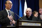Ramsey County District Attorney Jon Choi stood with Archbishop Bernard Hebda during a press conference after submitting their final progress report on