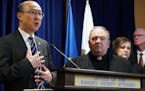 Ramsey County District Attorney Jon Choi stood with Archbishop Bernard Hebda during a press conference after submitting their final progress report on