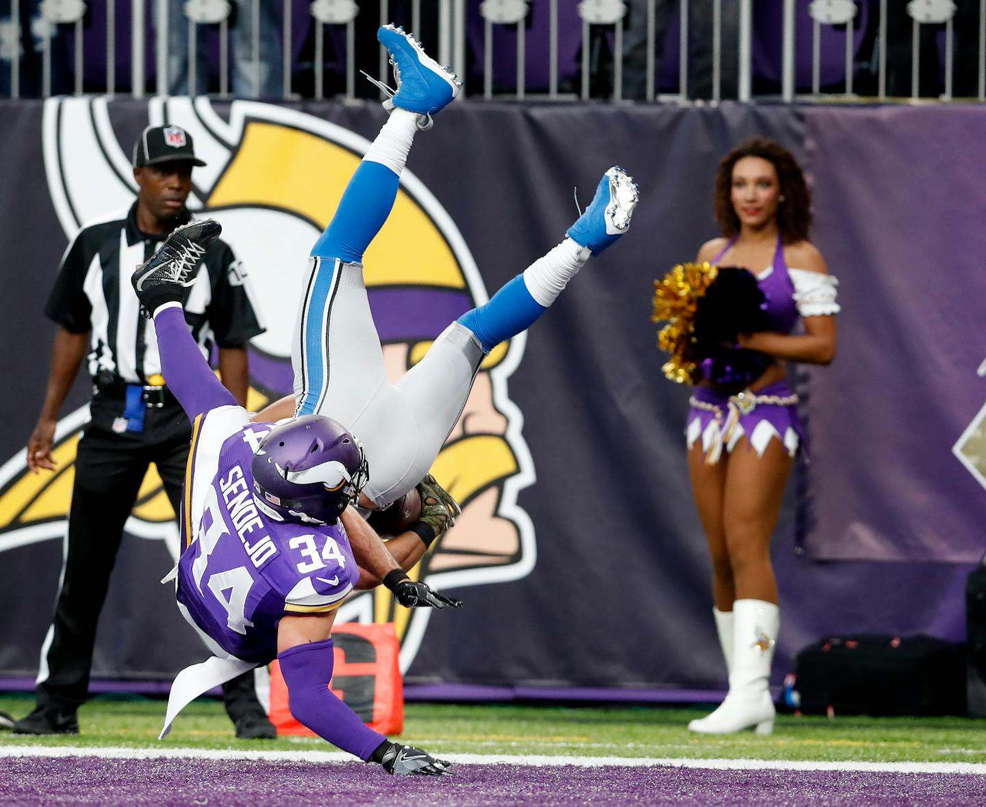 Andrew Sendejo (34) hit Golden Tate (15) as he leapt into the end zone to score the winning touchdown in overtime. Detroit beat Minnesota by a final score of 22-16.