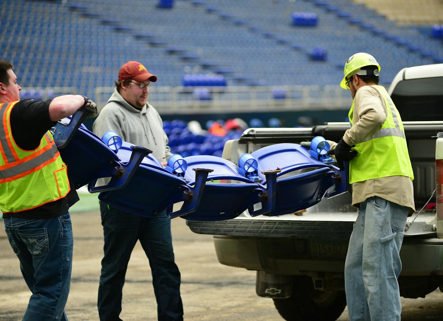 Email and phone requests for the 60,000 Metrodome seats are overwhelming staff at Albrecht Signs in Fridley which is tasked with removing and selling seats to fans. Andrew Greene on the left and William Epps load Metrodome seats into a truck for Jacob Hoscheit of Caledonia Mn. ] Richard.Sennott@startribune.com Richard Sennott/Star Tribune Minneapolis Minn. Tuesday 1/7/2014) ** (cq)