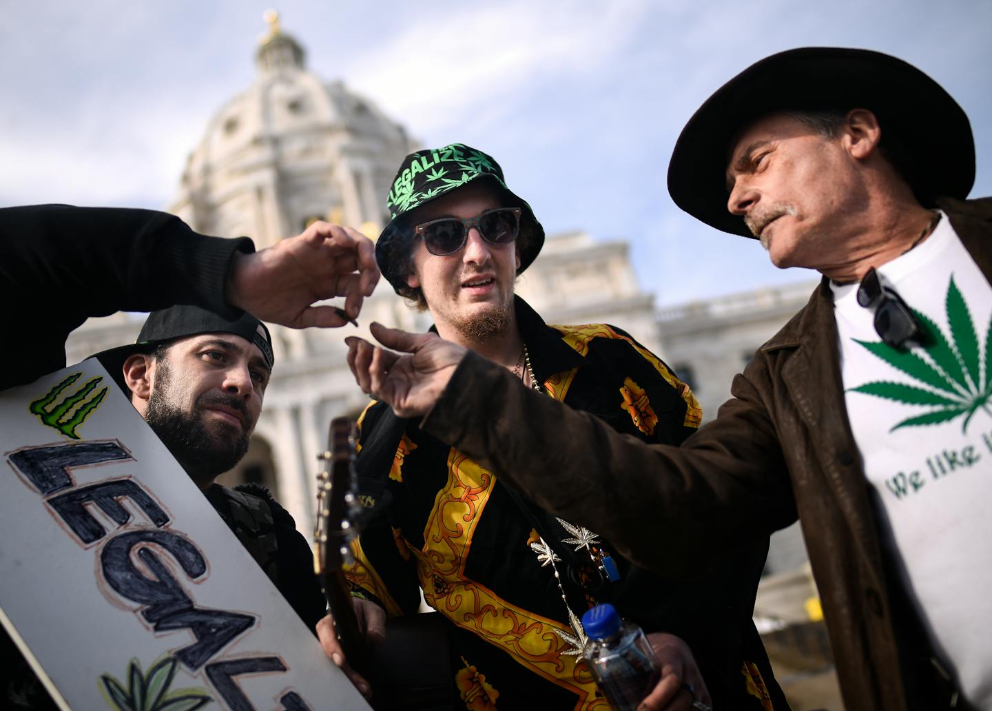 From left, Daniel Beckenbach, Grant Wilkinson and Tom Davison passed a joint in front of the Minnesota Capitol Friday afternoon. Davison said he was busted for selling a large quantity of marijuana in 1976 and "lifes been tough ever since." ] AARON LAVINSKY &#x2022; aaron.lavinsky@startribune.com About 125 people attended Cannabis Awareness Day at the Minnesota State Capitol on Friday, April 20, 2018 in St. Paul, Minn. The event sought to raise awareness for state and federal marijuana legalizat