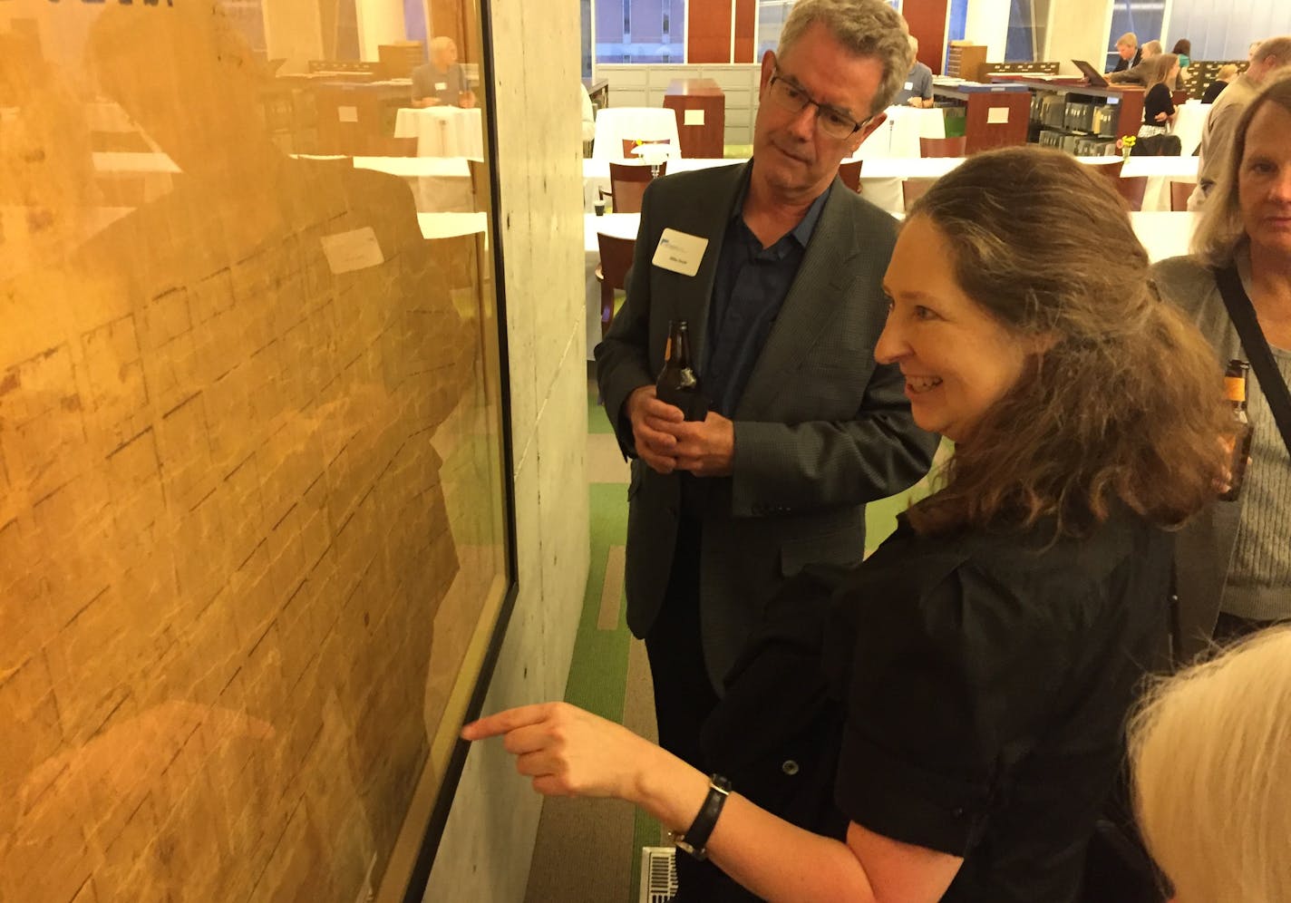 Paper conservator Dianna Clise explains an 1855 map of the city that she spent four months painstakingly restoring. An 1855 map unveiled at Hennepin County Library in downtown Minneapolis on Thursday night. It was signed by many of the city's early business luminaries.