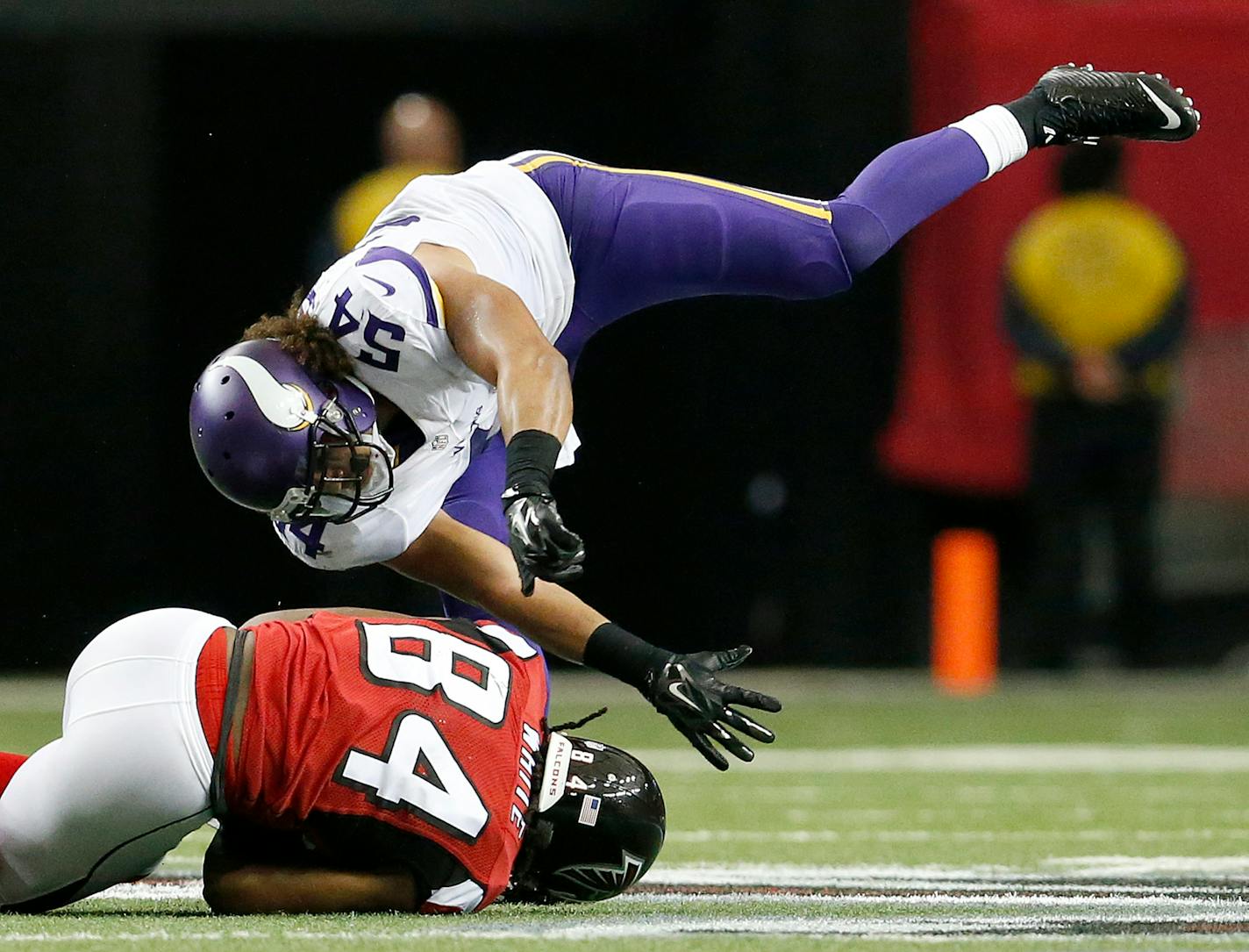 Vikings' Eric Kendricks (54) tackles Atlanta's Roddy White (84) in the second quarter Sunday.