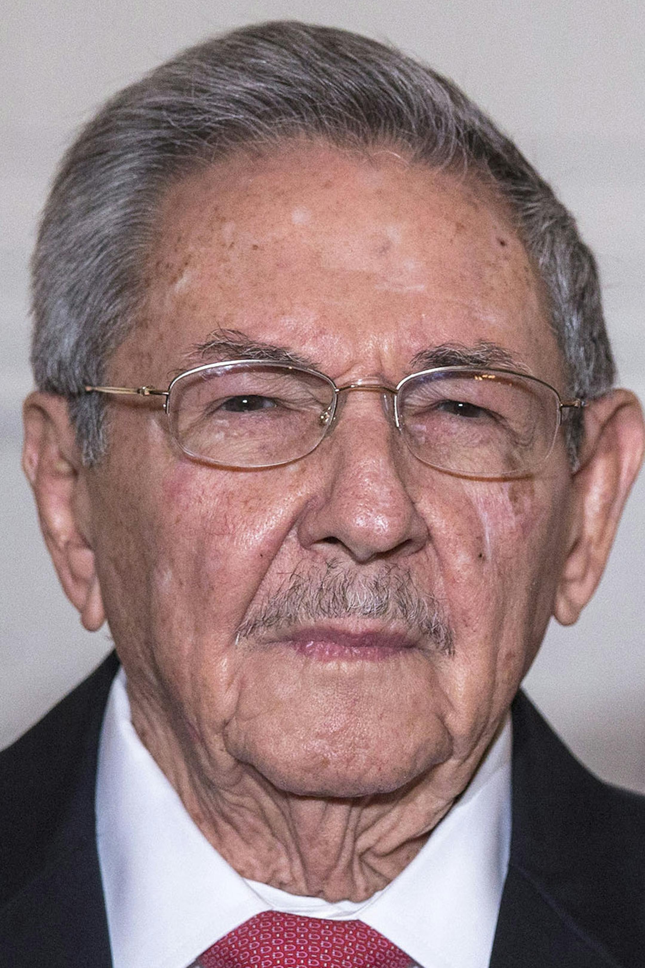 Cuban President Raul Castro attends an agreements' signing ceremony with French President Francois Hollande during a meeting at the Elysee Palace in Paris, France, Monday, Feb. 1, 2016. Cuban President Raul Castro is paying a state visit to France, in the first European foray by a Cuban leader in two decades, as Cuba opens up its economy. (Etienne Laurent, Pool photo via AP) ORG XMIT: MIN2016030815160126
