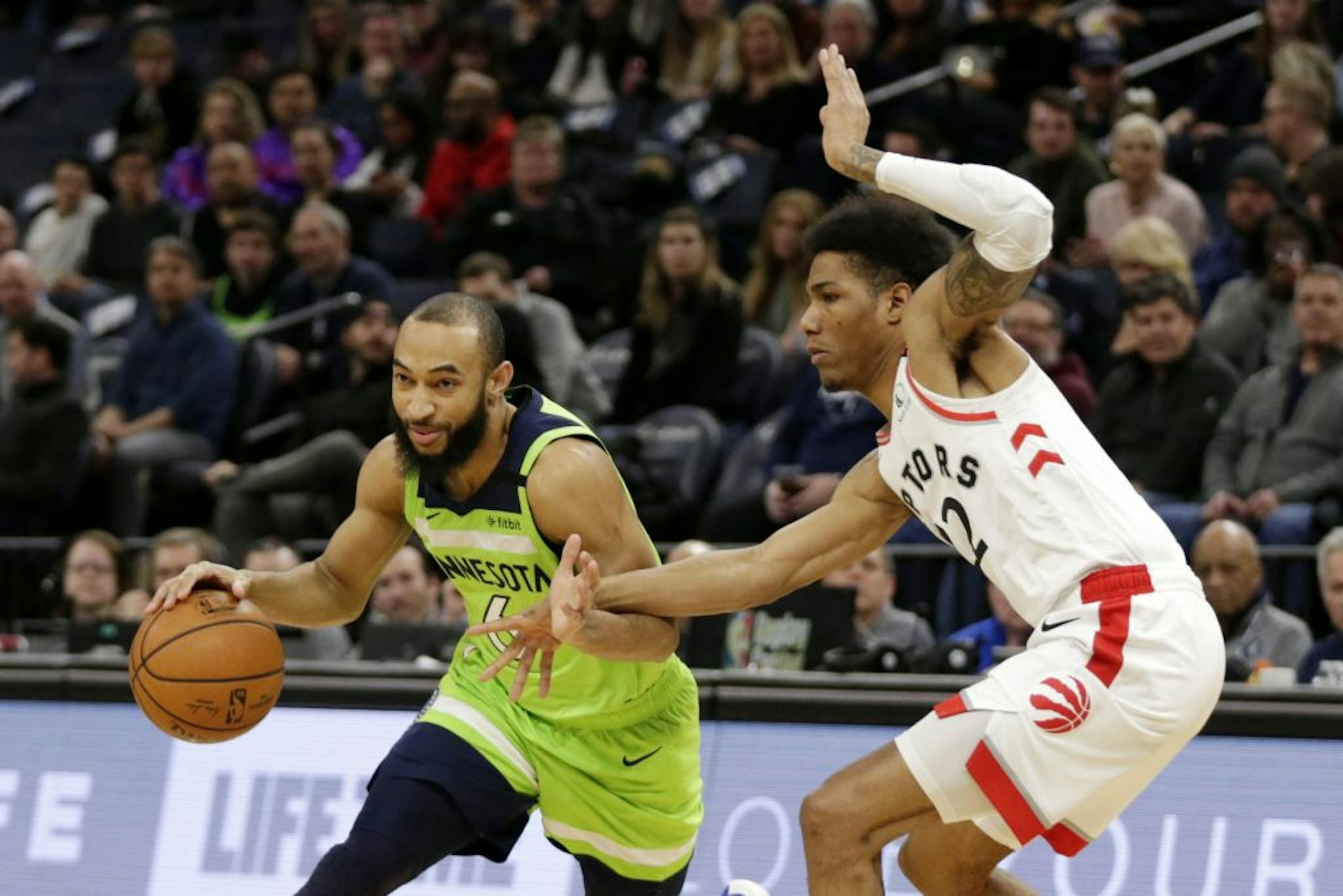 Minnesota Timberwolves guard Jordan McLaughlin (6) drives against Toronto Raptors guard Patrick McCaw (22) in the first quarter of an NBA basketball game Saturday, Jan. 18, 2020, in Minneapolis.