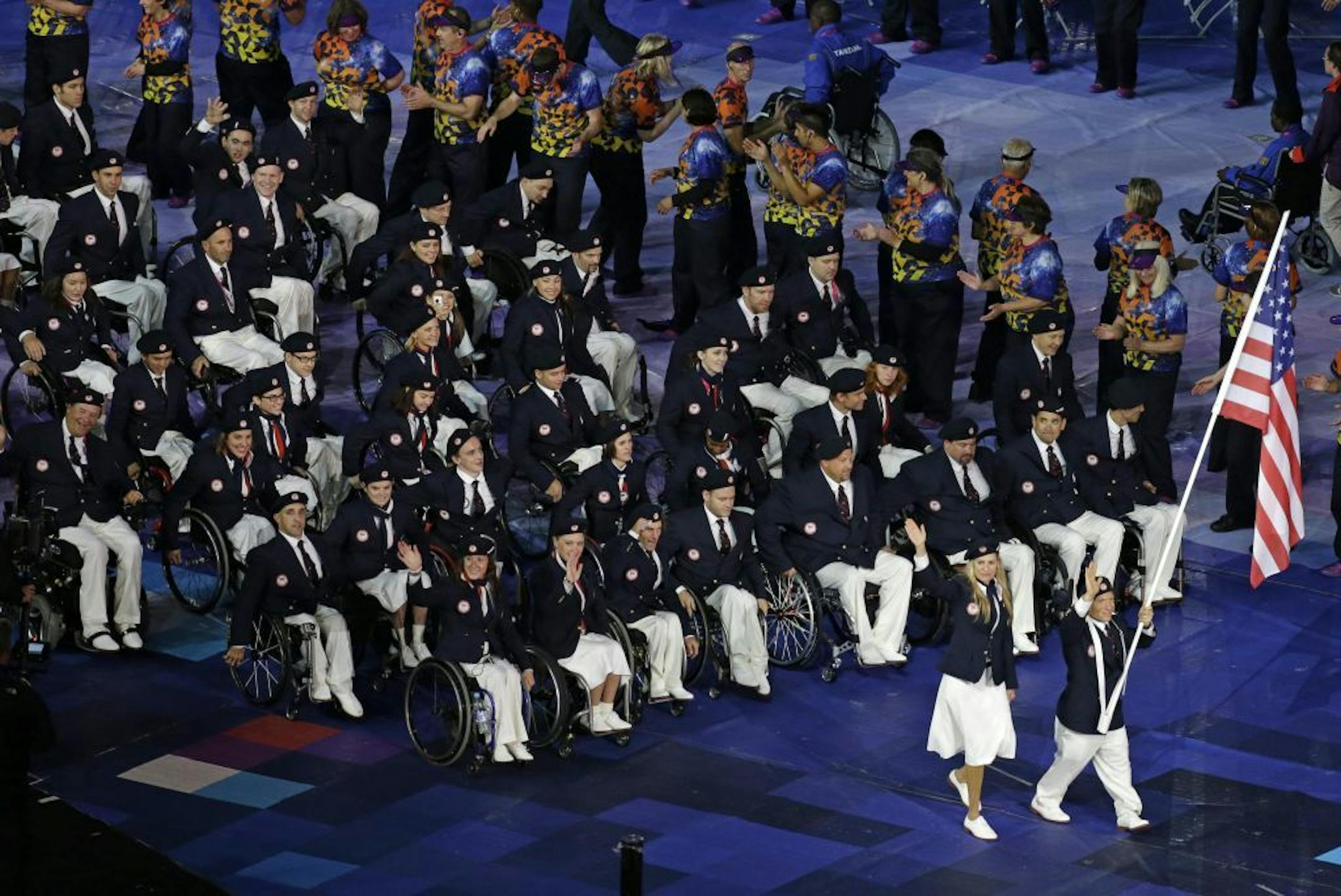 U.S. flagbearer discus thrower Scott Danberg from Cooper City, Fla. leads his team during the Opening Ceremony for the 2012 Paralympics in London, Wednesday Aug. 29, 2012.