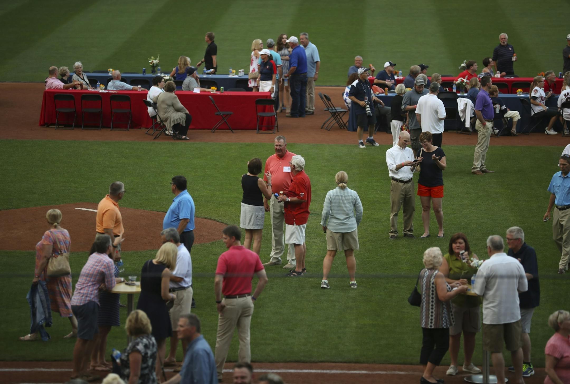 Fans and players visited in the infield during the Twins' 1987 Summer Celebration Thursday night.
