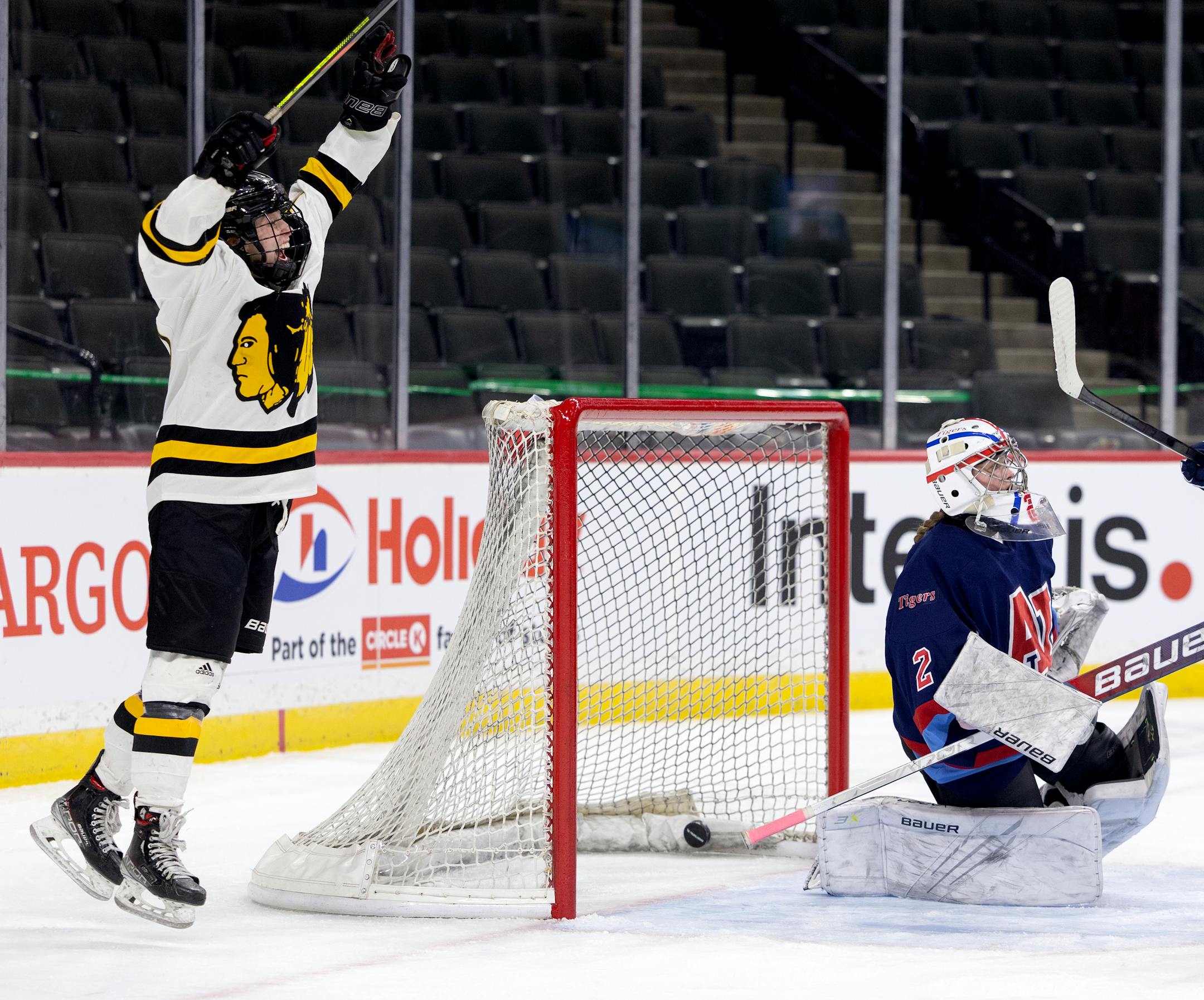 Emmie Hardwick (10) of Warroad celebrates a goal by Maddie Skogman in the first period.