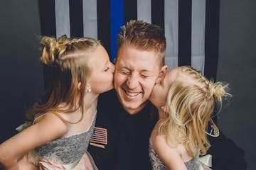 Waseca police officer Arik Matson with his daughters, Audrina and Maklynn, before his injury.