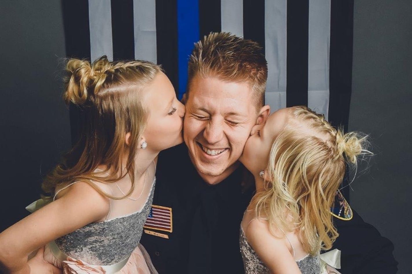 Waseca police officer Arik Matson with his daughters, Audrina and Maklynn, before his injury.