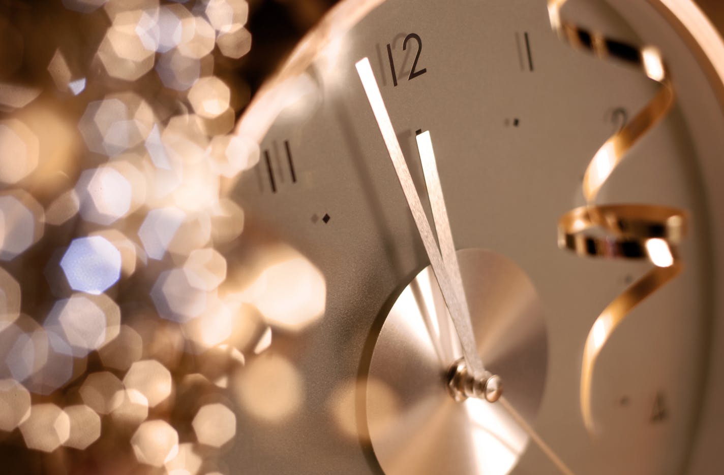 A clock before midnight on New Year's eve.