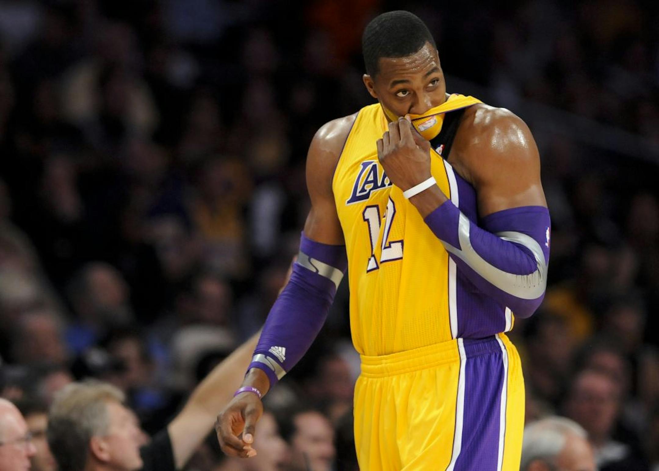 Los Angeles Lakers center Dwight Howard looks on as he leaves the court in the first half of an NBA basketball game against the Los Angeles Clippers, Friday, Nov. 2, 2012, in Los Angeles.