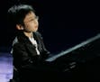 Piano/cello prodigy Marc Yu, at age 9, performed during a song contest in San Remo, Italy, in 2008. Antonio Calanni • Associated Press