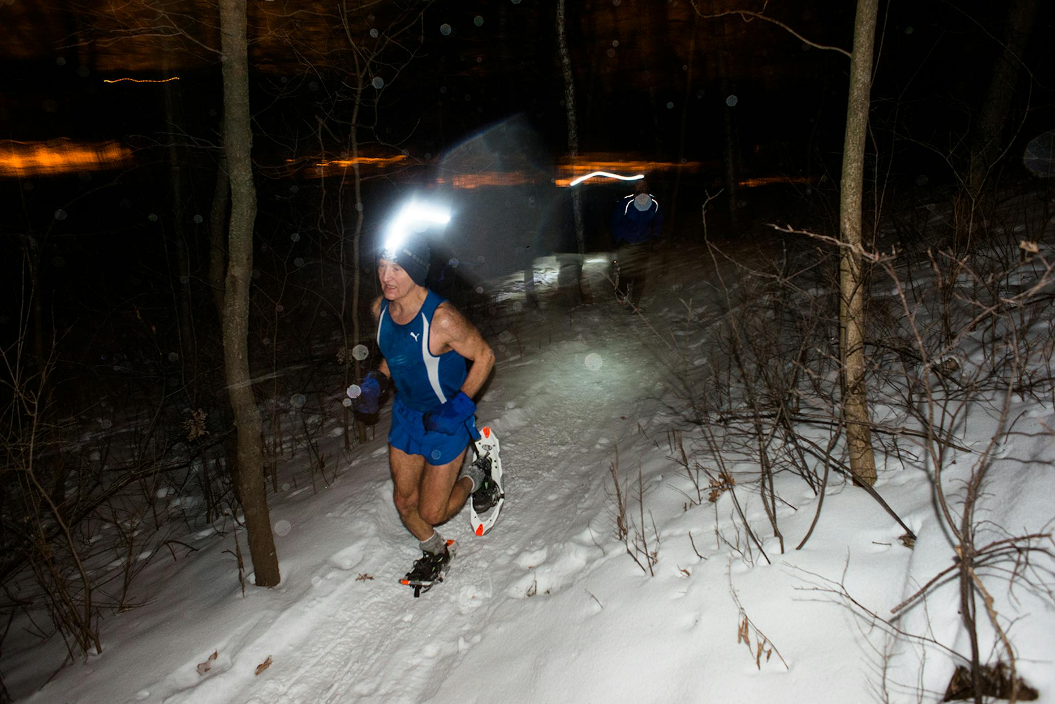 Jim McDonell, of Woodbury, ran though a dark trail Jan. 6 in Carver Lake Park.