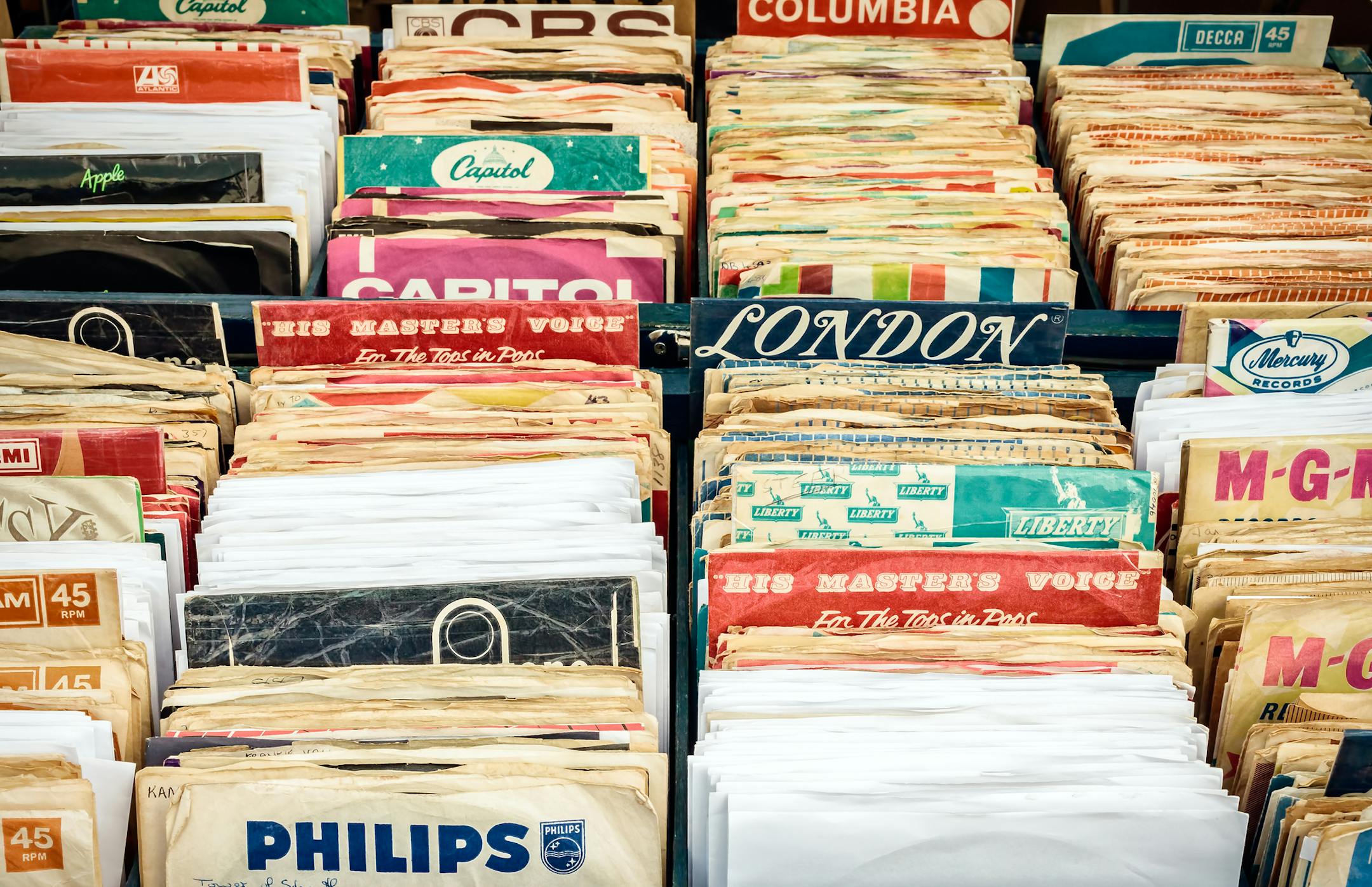 Rosmalen, The Netherlands - May 10, 2015: Wooden boxes with vinyl turntable records on a flee market in Rosmalen, The Netherlands
