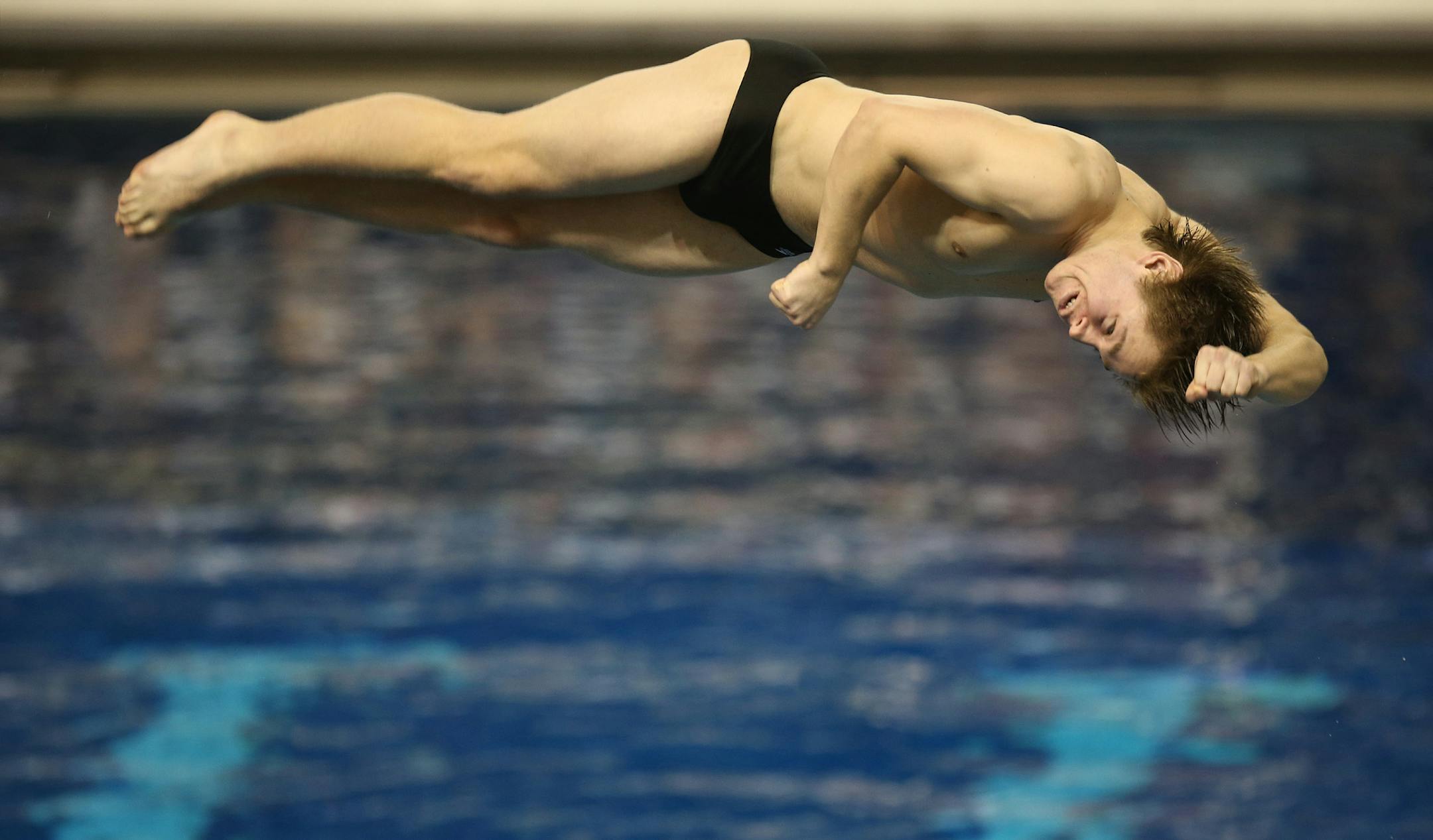 Stillwater's Colin Eason performed his second dive of the state championship. ] (KYNDELL HARKNESS/STAR TRIBUNE) kyndell.harkness@startribune.com 2A boys swimming and diving state championship at the University of Minnesota's Aquatic Center in Minneapolis Min., Saturday, March 7, 2015.