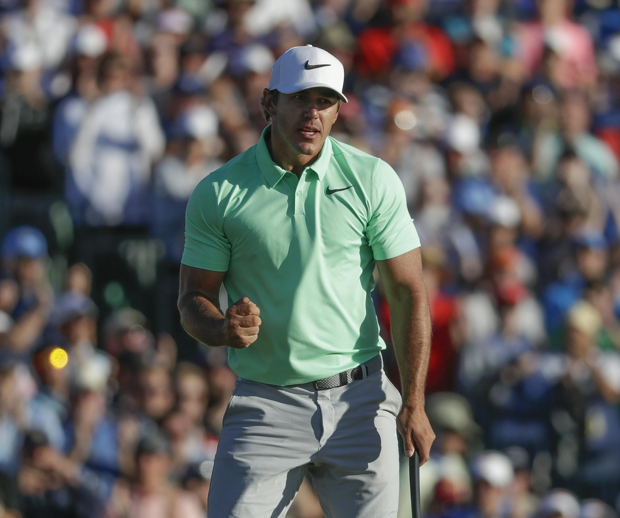 Brooks Koepka celebrates after the fourth round of the U.S. Open golf tournament Sunday, June 18, 2017, at Erin Hills in Erin, Wis. (AP Photo/Chris Carlson)