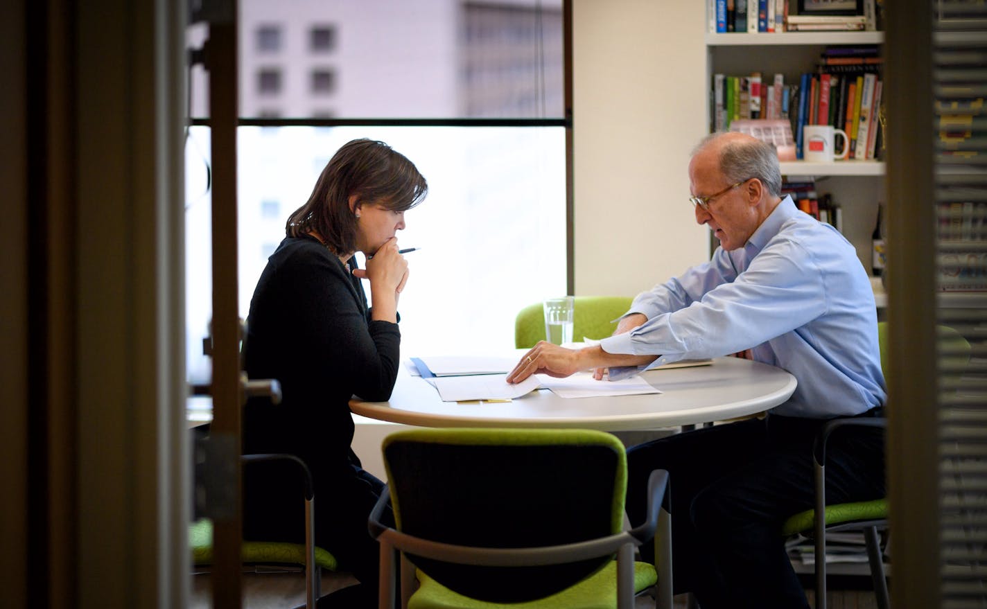 Reedy looked over financial reports with Bush Foundation CFO Greg Keane.