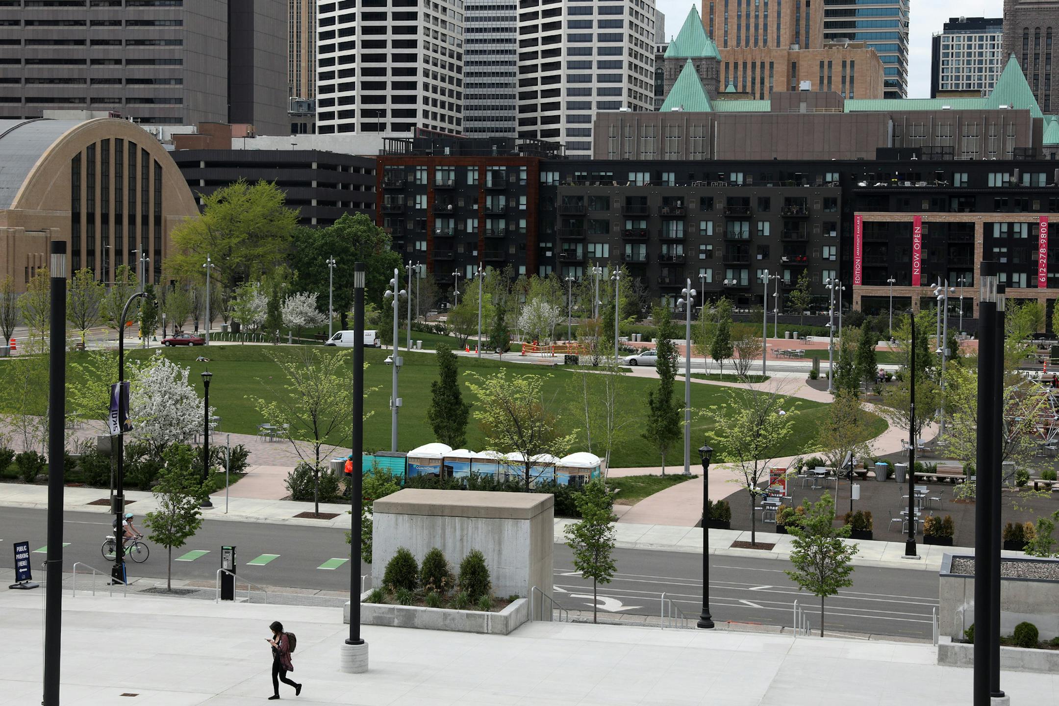 A pedestrian walks past Downtown East Commons.