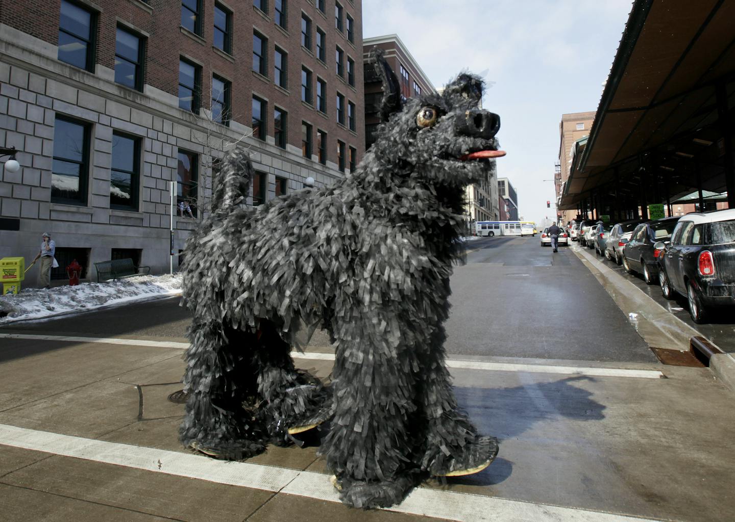 It takes two people to wear the Black Dog costume, Nigel Parry in the front and James Duncan in the back. The Black Dog took a walk around the Farmer's Market in St. Paul in front of the Black Dog Cafe, at 308 E. Prince St., St. Paul, MN., MN on March 14, 2013. ] JOELKOYAMA&#x201a;&#xc4;&#xa2;joel koyama@startribune.com 78408 Artists and bureaucrats might seem to be strange bedfellows. But the Twin Cities are at the forefront of a national movement that using artistically creative minds to help