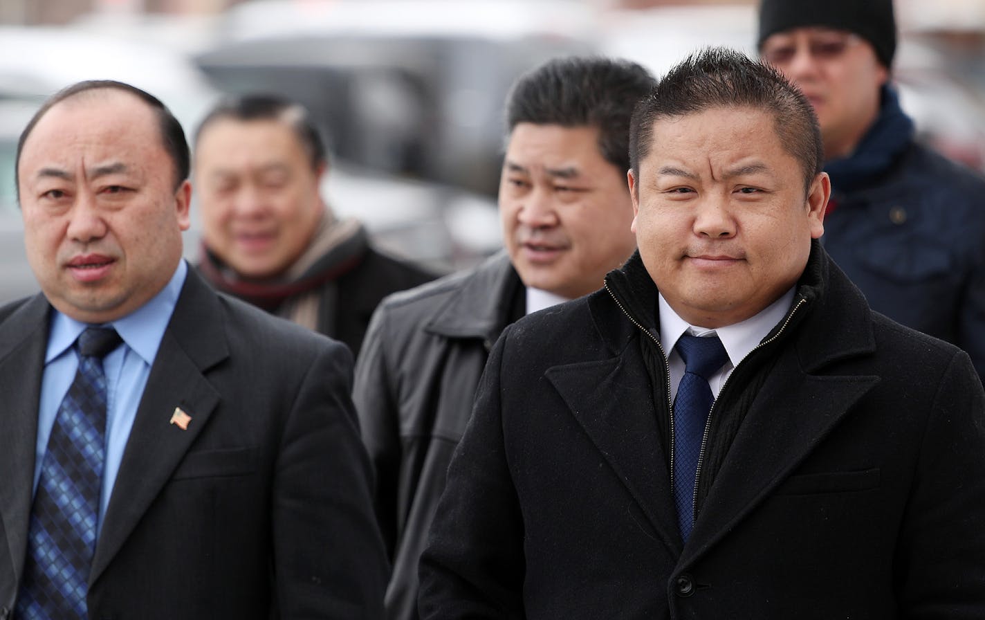 St. Paul City Council Member Dai Thao, right, walked with a group of men into the Ramsey County Law Enforcment Center for his hearing Tuesday. ] ANTHONY SOUFFLE &#x2022; anthony.souffle@startribune.com St. Paul City Council Member Dai Thao made his first appearance in Ramsey County District Court Tuesday, March 6, 2018 in St. Paul, Minn. He has been charged with three misdemeanors for allegedly helping a woman vote while he was running for mayor.