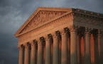 FILE - This Oct. 4, 2018, file photo shows the U.S. Supreme Court at sunset in Washington. More than 200 corporations have signed a friend-of-the-cour