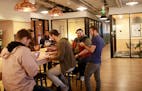 Twin Cities Startup Week starts Oct. 6. Shown is a gathering during last year's event at the WeWork office of workers from out of town that the startu