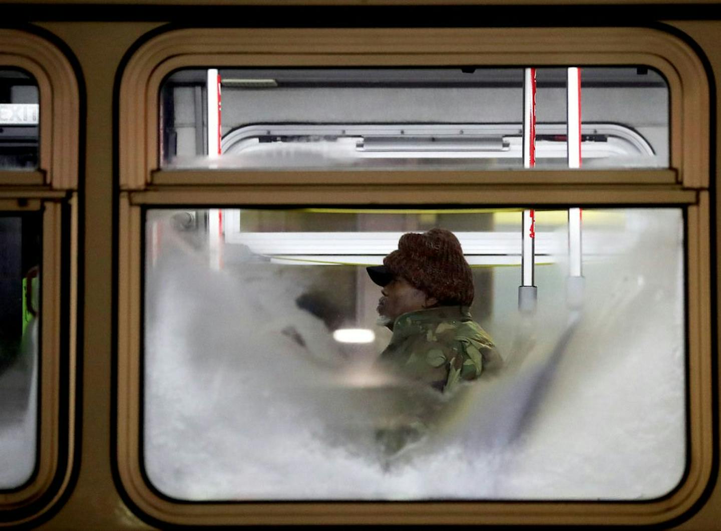 A bus commuter is obscured by a frost covered window at the Midtown Station Bus station on Chicago near Lake Street as cold weather has descended on the state and metro area Tuesday, Dec. 10, 2019, in Minneapolis, MN.