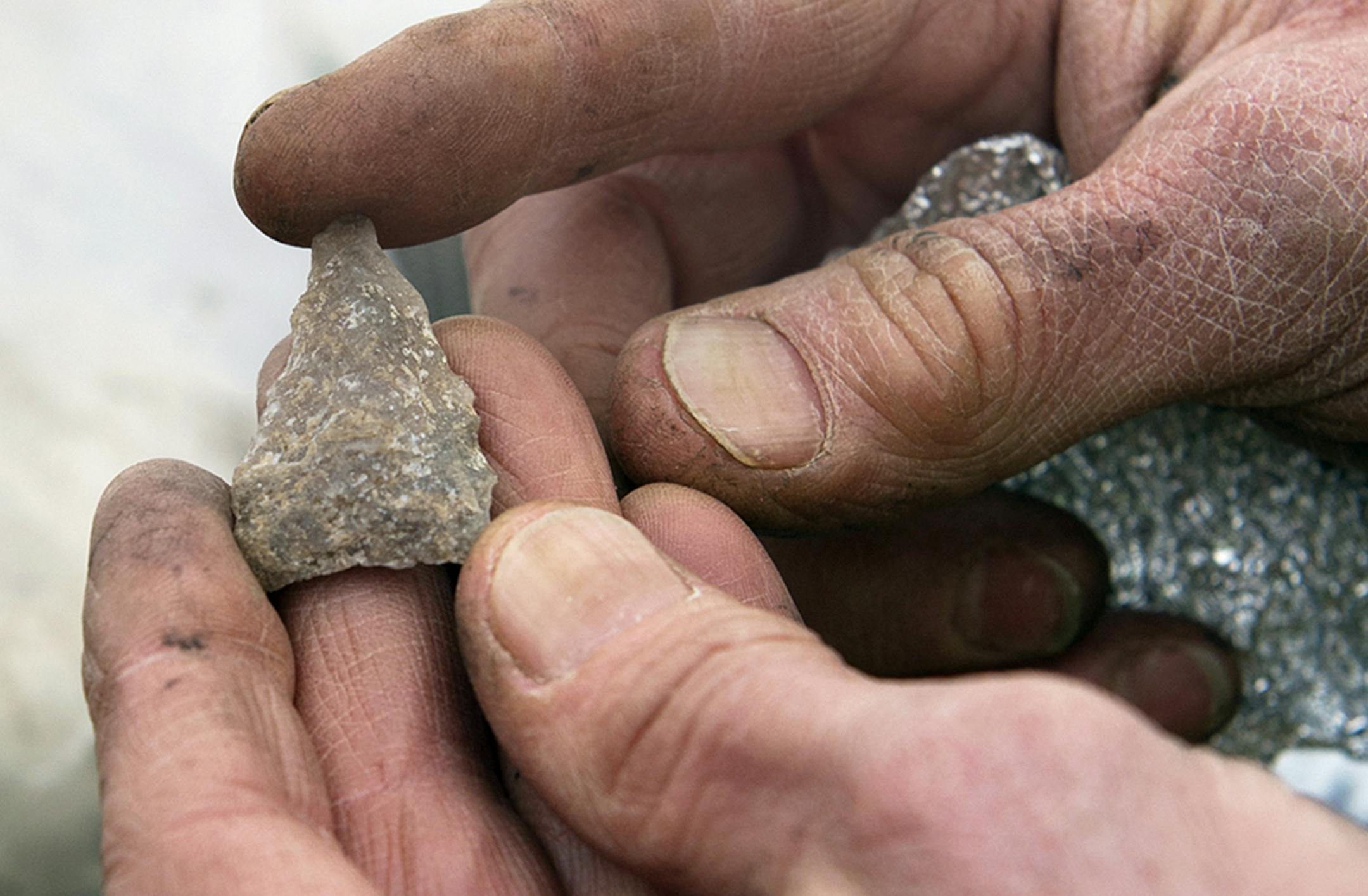 Kent Bakken holds an arrowhead estimated to be around 8,000 years old.