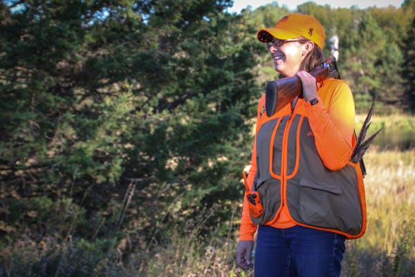 Julia Schrenkler of St.Paul learned to hunt as an adult, and especially enjoys working her dog Wren in praiurie grasses for pheasants or in the woods 