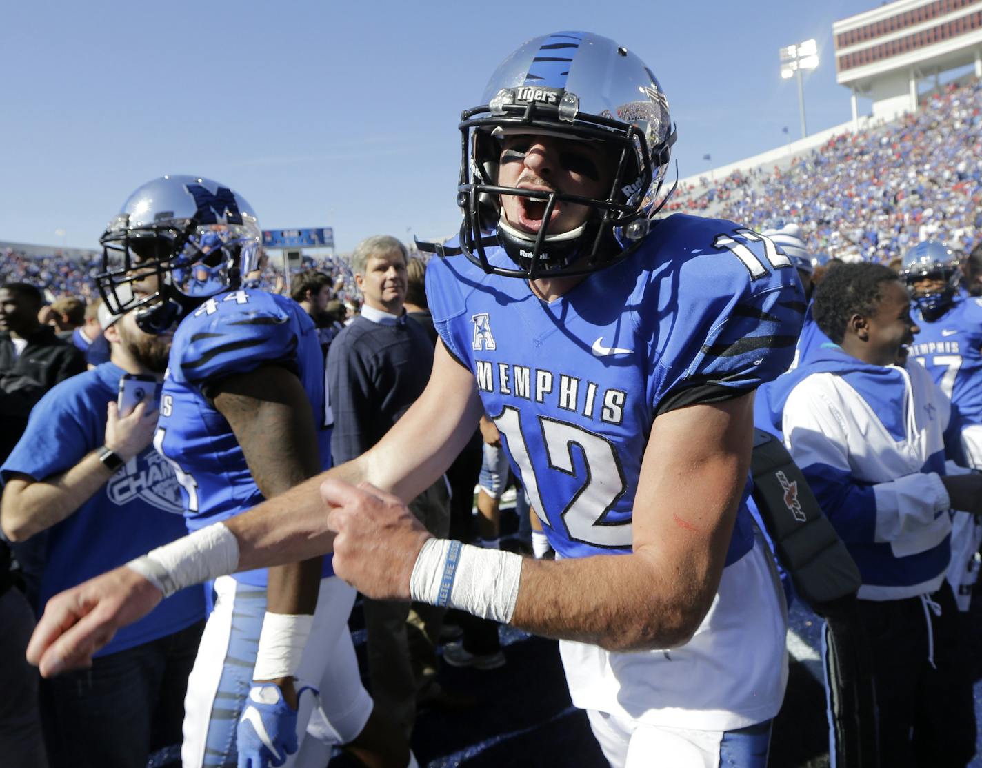 Memphis quarterback Paxton Lynch (12) yells as he celebrates after Memphis upset No. 13 Mississippi 37-24 in an NCAA college football game Saturday, Oct. 17, 2015, in Memphis, Tenn. (AP Photo/Mark Humphrey)