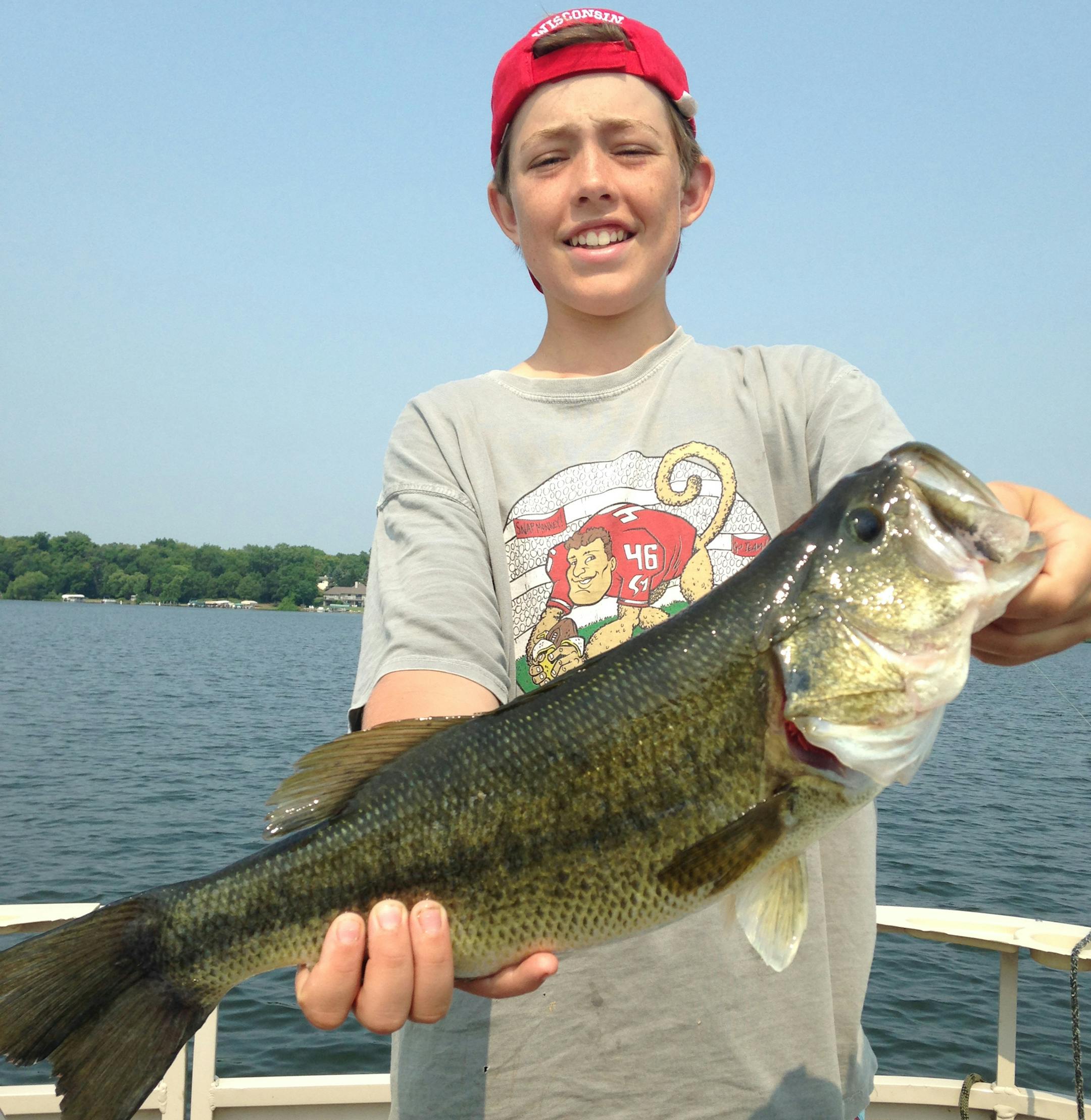 SPECIAL FISH Adam Schneck, 13, of Minnetonka, caught and released this largemouth bass on Lake Minnewashta while fishing with his grandfather, Stew Peterson, and cousin. The photo has special meaning now: Peterson died of a heart attack days later. ìThis was his last fishing outing with his grandson,íí said Adamís dad, Jay Schneck. ìHis love in life was teaching people and his family to fish.íí
