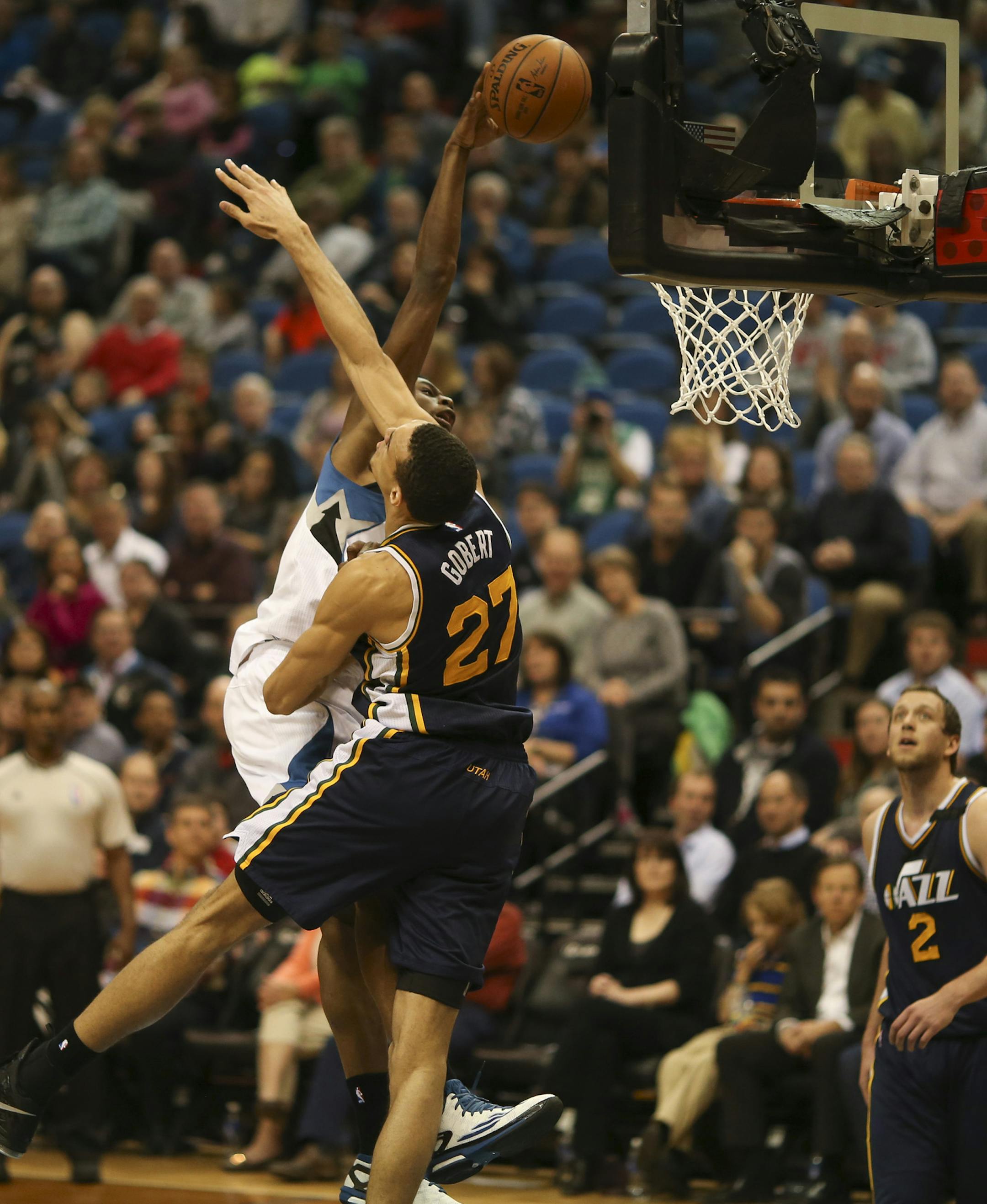 Minnesota Timberwolves forward Andrew Wiggins dunked in the second quarter over Utah Jazz center Rudy Gobert Monday night at Target Center. ] JEFF WHEELER &#xef; jeff.wheeler@startribune.com The Minnesota Timberwolves faced the Utah Jazz Monday night, March 30, 2015 at Target Center in Minneapolis.