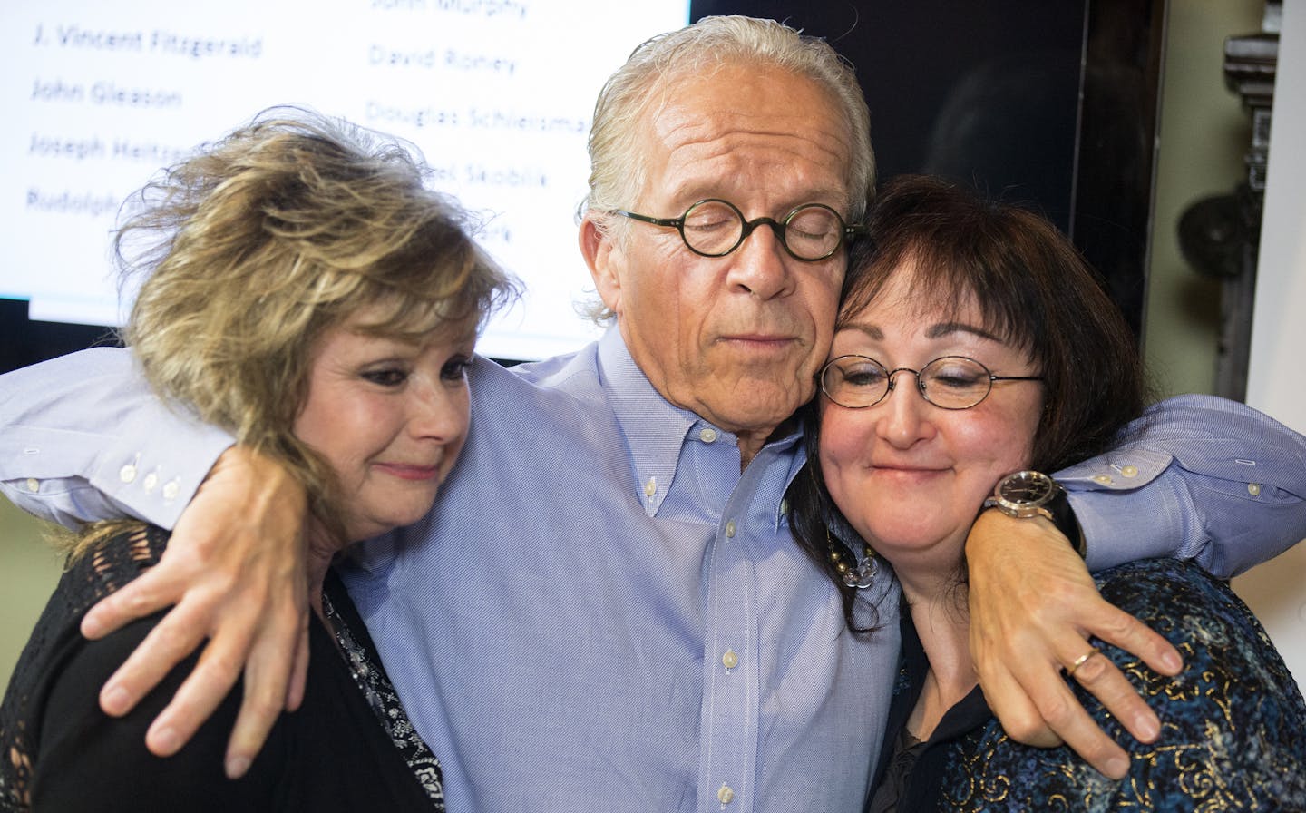 Attorney Jeff Anderson embraces Lori Stoltz, right, and Kim Schmit, two of the victims of deceased Diocese of New Ulm priest Fr. David Roney after a press conference at Jeff Anderson & Associates law office in St. Paul. The two women originally came out as Jane Doe's in the lawsuit. ] (Leila Navidi/Star Tribune) leila.navidi@startribune.com BACKGROUND INFORMATION: Tuesday, March 29, 2016 in St. Paul. The Diocese of New Ulm released the names of 16 priests credibly accused of sexually abusing chi