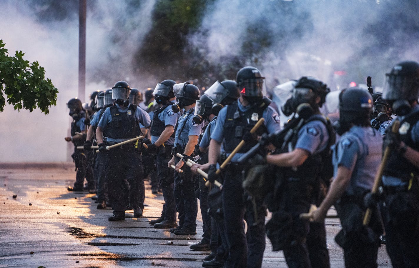 Most protesters were peaceful while a few started destroying police property. Peaceful protesters pleaded with those who resorted to violence to stop. Police secured the precinct from further property damage with riot police and tear gas.] George Floyd, a middle-aged man died after a confrontation with Minneapolis on Monday evening. A bystander video that started circulating sometime after the incident appeared to show the man pleading with officers that he couldn't breathe as one officer knelt