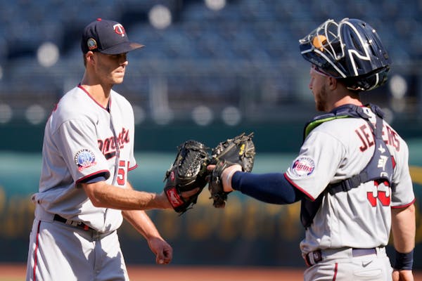 Twins closer Taylor Rogers celebrated with catcher Ryan Jeffers after finishing off a 5-4 victory over the Royals in Kansas City, Mo., on Sunday.
