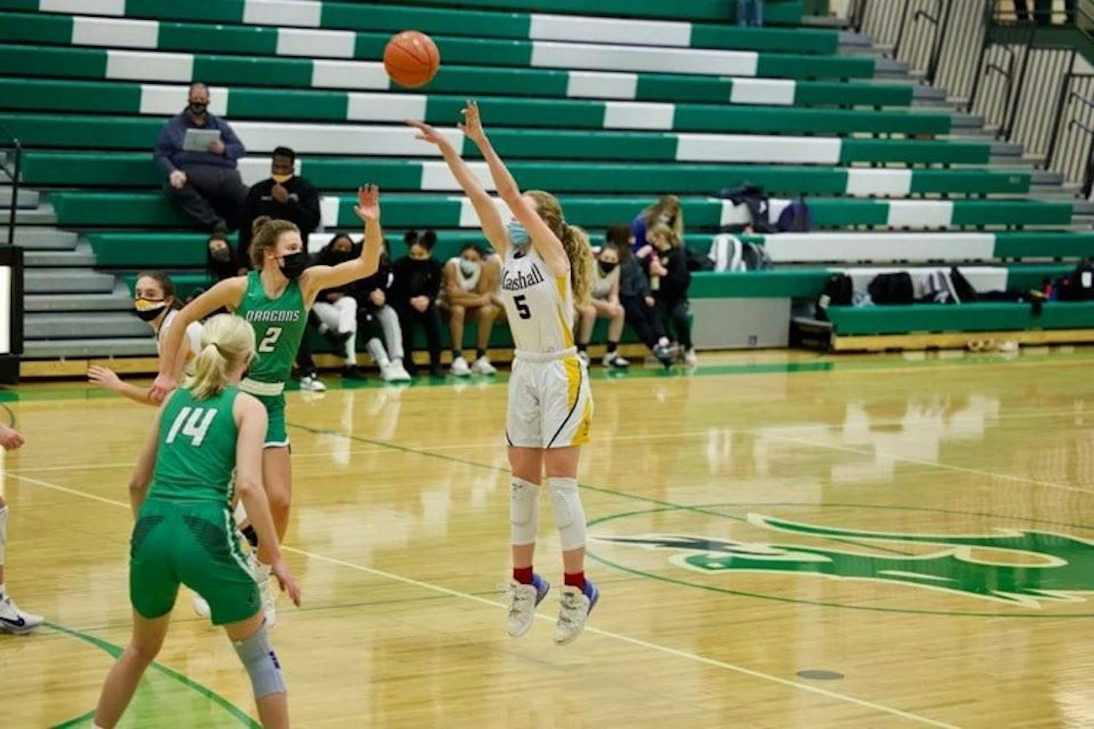 Gianna Kneepkens of Duluth Marshall made this shot from beyond the three-point line to record the 3,000th point of her high school career on Friday in a game at Pine City. Photo: Justin Jahnz, Four Seasons Photography