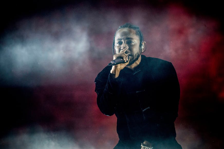 FILE - Kendrick Lamar performs at Coachella Music & Arts Festival at the Empire Polo Club on Sunday, April 16, 2017, in Indio, Calif. Kendrick Lamar turned his Juneteenth “Pop Out” concert into a celebration of Los Angeles unity. The 37-year-old rapper curated a three-hour livestreamed concert featuring a mix of up-and-coming LA rappers and stars including Dr. Dre and Tyler, The Creator.  (Photo by Amy Harris/Invision/AP, File)