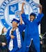 Two seniors dance and celebrate as they walk off the stage the Hopkins High School graduation ceremony Tuesday, June 6, 2023, at Maturi Pavilion on th