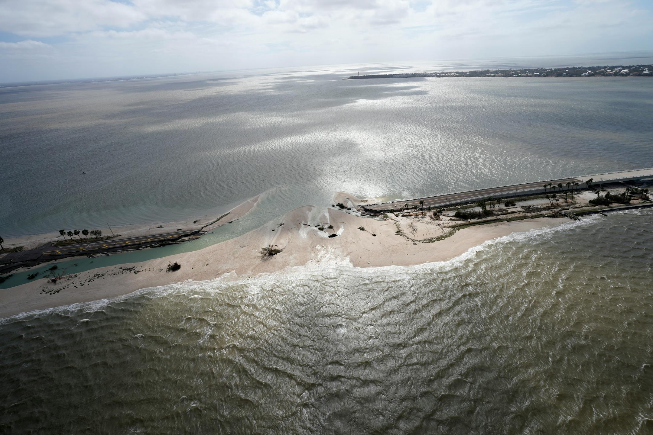 A damaged causeway to Florida's Sanibel Island is seen in the aftermath of Hurricane Ian on Thursday, Sept. 29, 2022. (AP Photo/Wilfredo Lee)