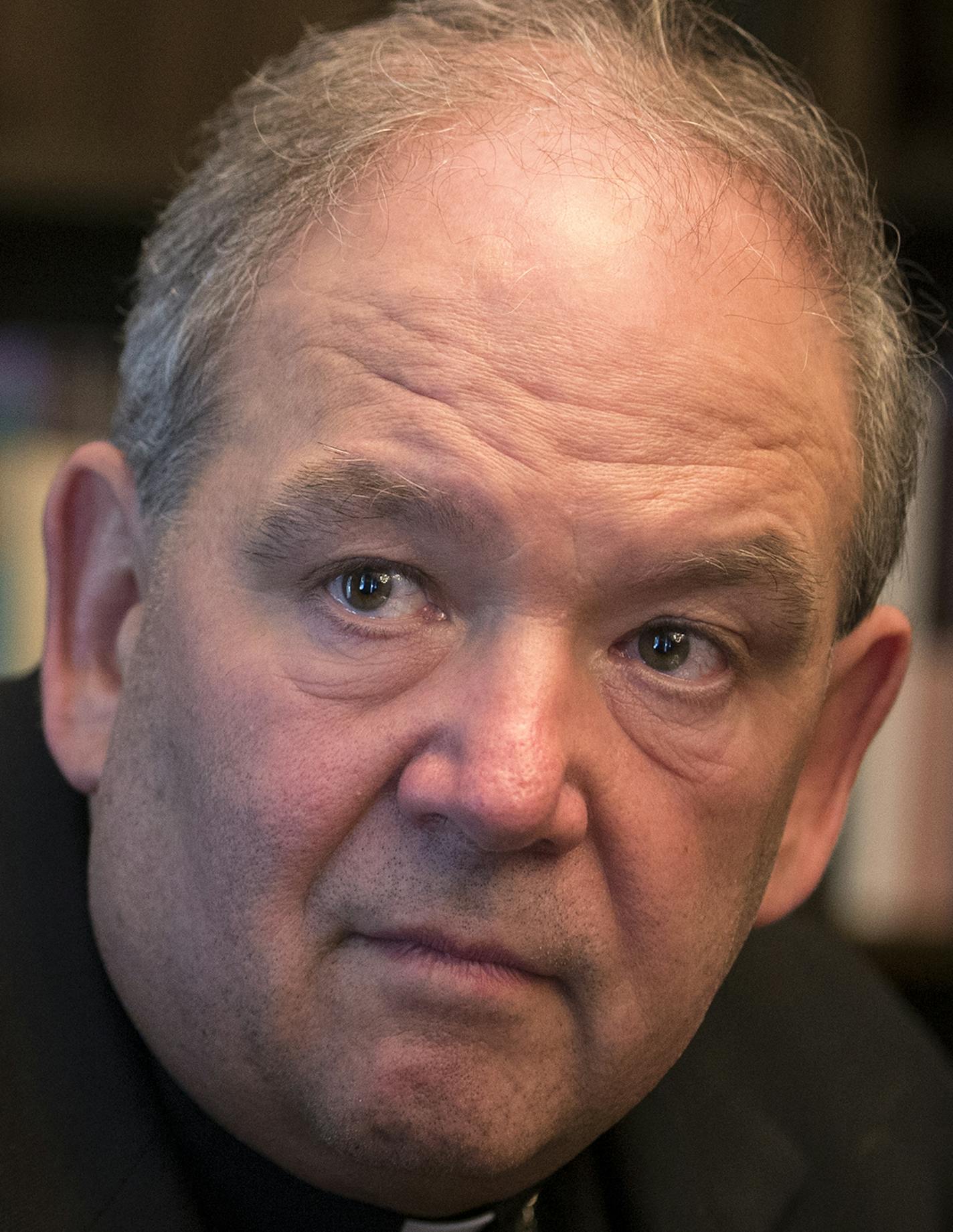 Archbishop Bernard Hebda, right, and the archdiocese's bankruptcy attorney Charles Rogers speak during an interview at the offices of the Archdiocese of St. Paul on Tuesday, August 4, 2015. ] LEILA NAVIDI leila.navidi@startribune.com / BACKGROUND INFORMATION: With the deadline for filing claims against the St. Paul and Minneapolis archdiocese now closed, the church is facing more than 650 claims in bankruptcy court for everything from parish insurance overpayments to media services. While the va