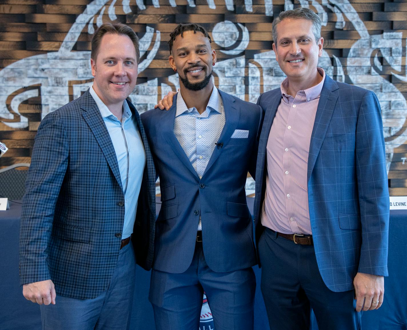 Minnesota Twins President of Baseball Operations, Derek Falvey, centerfielder Byron Buxton and Twins Senior Vice President, General Manager, Thad Levine pose for a photo after a press conference Wednesday, Dec. 1, 2021 at Target Field in Minneapolis, Minn. The Minnesota Twins announced that they have signed centerfielder Byron Buxton to a seven-year contract extension that will keep him in the Twin Cities through the 2028 season. ] CARLOS GONZALEZ • cgonzalez@startribune.com