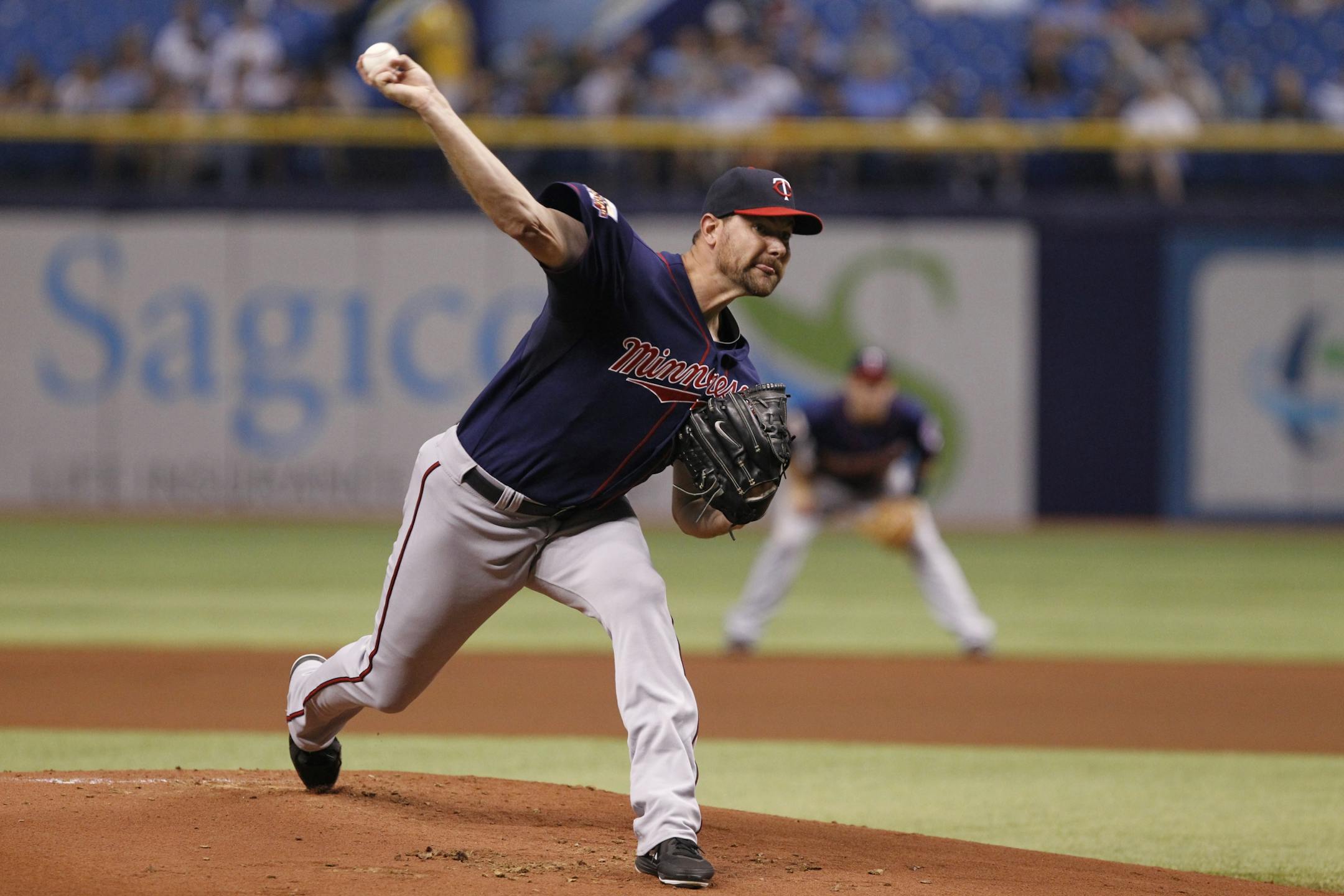 Minnesota Twins starting pitcher Mike Pelfrey delivers to the Tampa Bay Rays during the first inning of a baseball game Wednesday, April 23, 2014, in St. Petersburg, Fla.