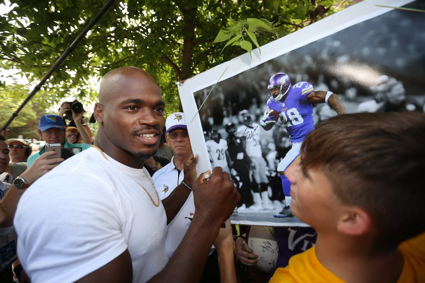 Adrian Peterson greeted fans as he arrived for Vikings training camp Saturday in Mankato.