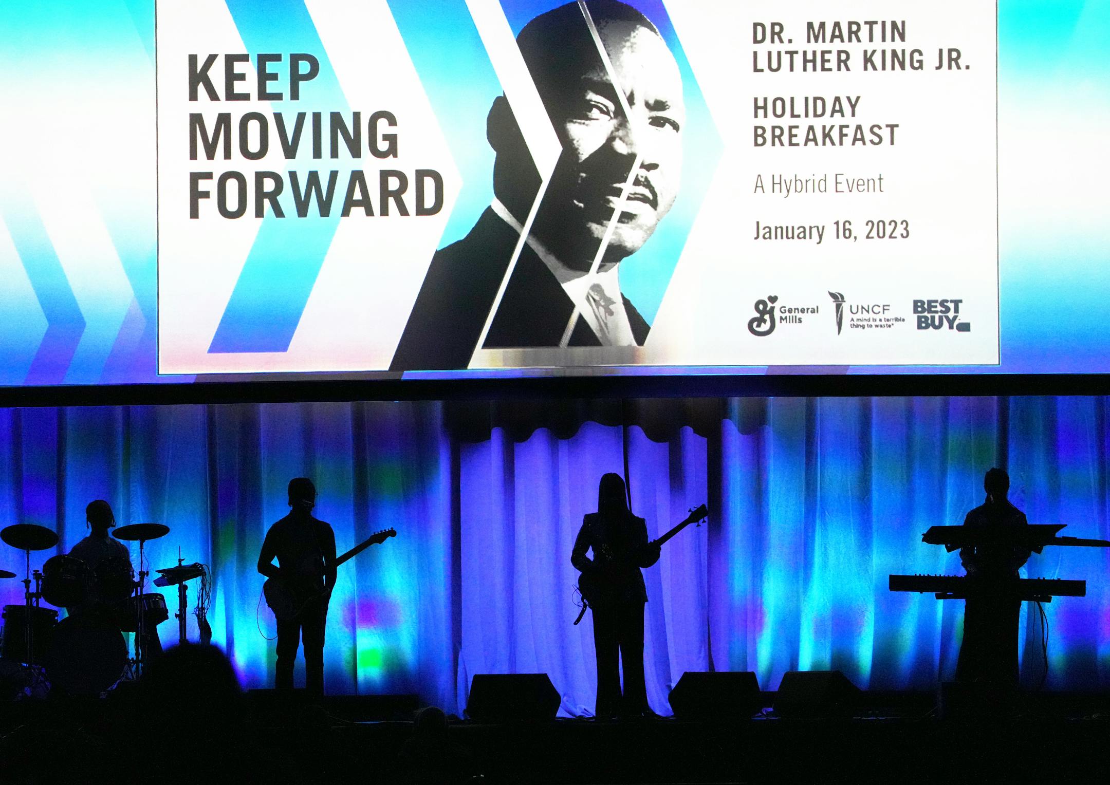 Members of the group NUNNABOVE were silhouetted as they took to the stage before performing "Lift Every Voice and Sing" at the 33rd annual Dr. Martin Luther King Jr. Holiday breakfast.