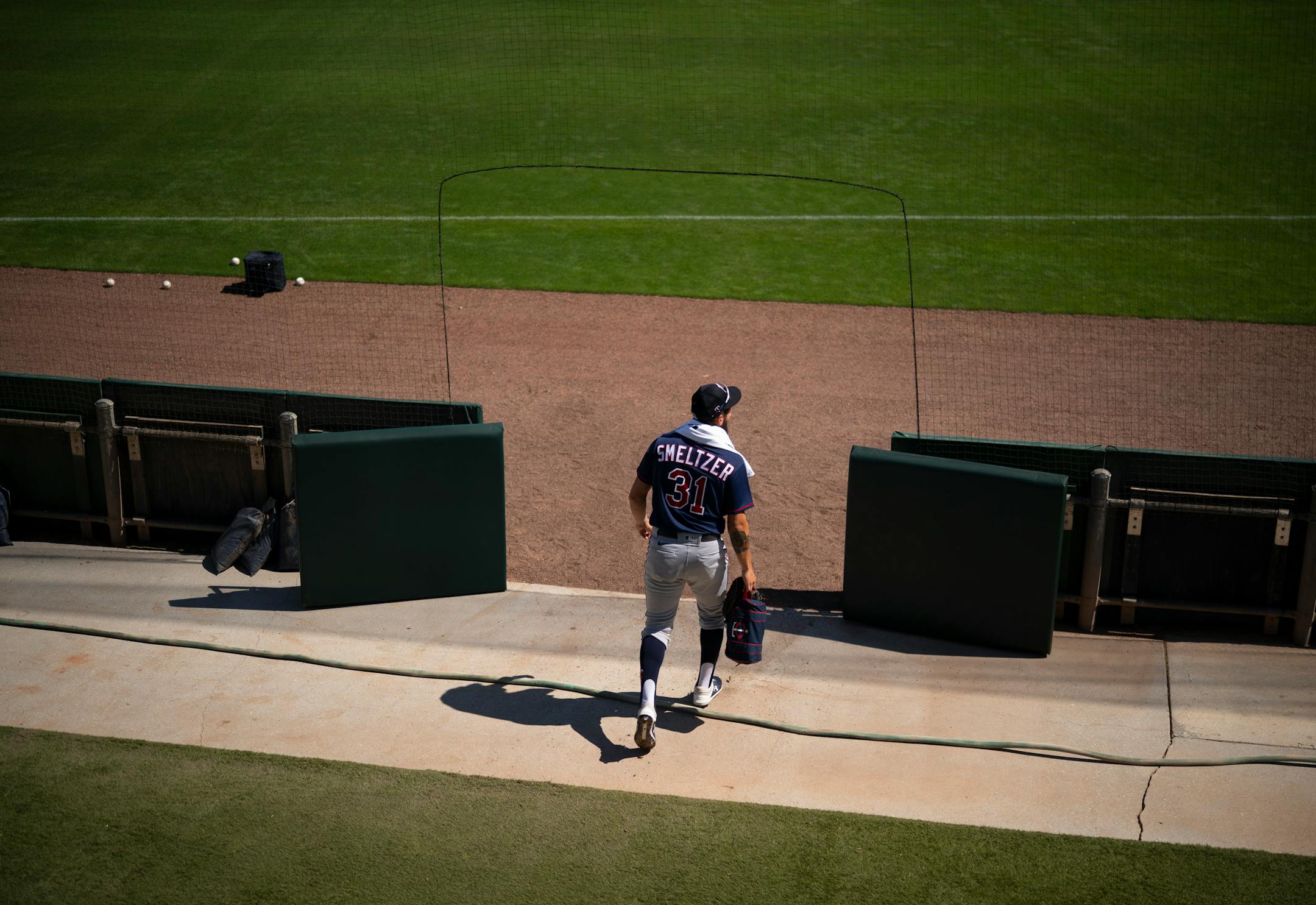 Minnesota Twins pitcher Devin Smeltzer walked to the pitchers mound to throw a bit of batting practice after he threw in the bullpen during Tuesday's first full squad workout.