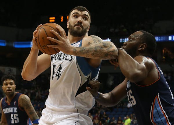 Wolves Nikola Pekovic tried to make a move tothe basket with Charlotte's Al Jefferson defending during the first half at Target Center in Minneapolis 