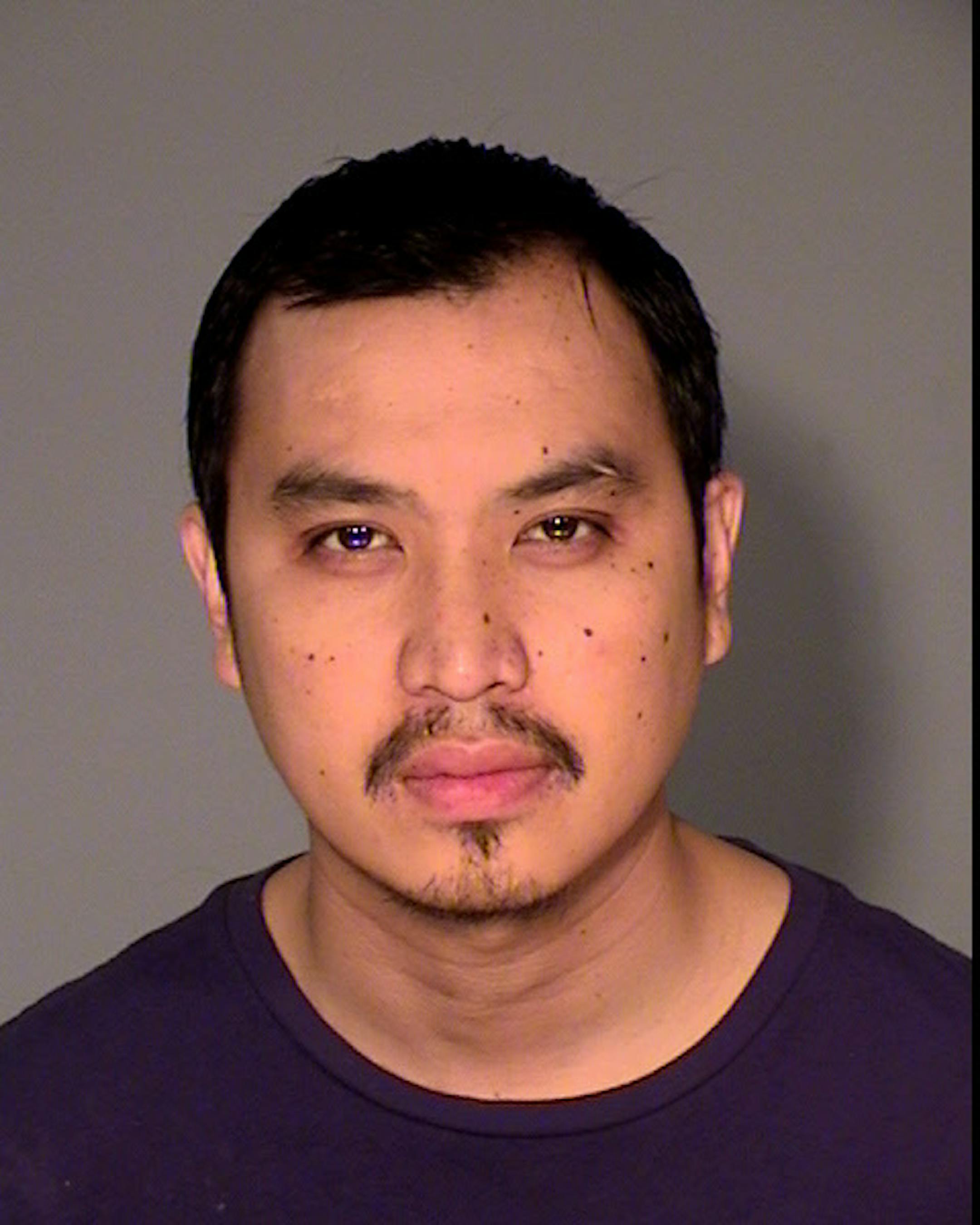 Teng Vang, charged in St. Paul robbery.